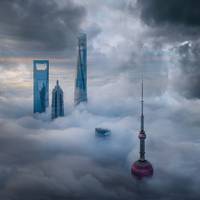 photographie aerienne d'une grande ville chinoise et de ses gratte-ciel qui percent les nuages